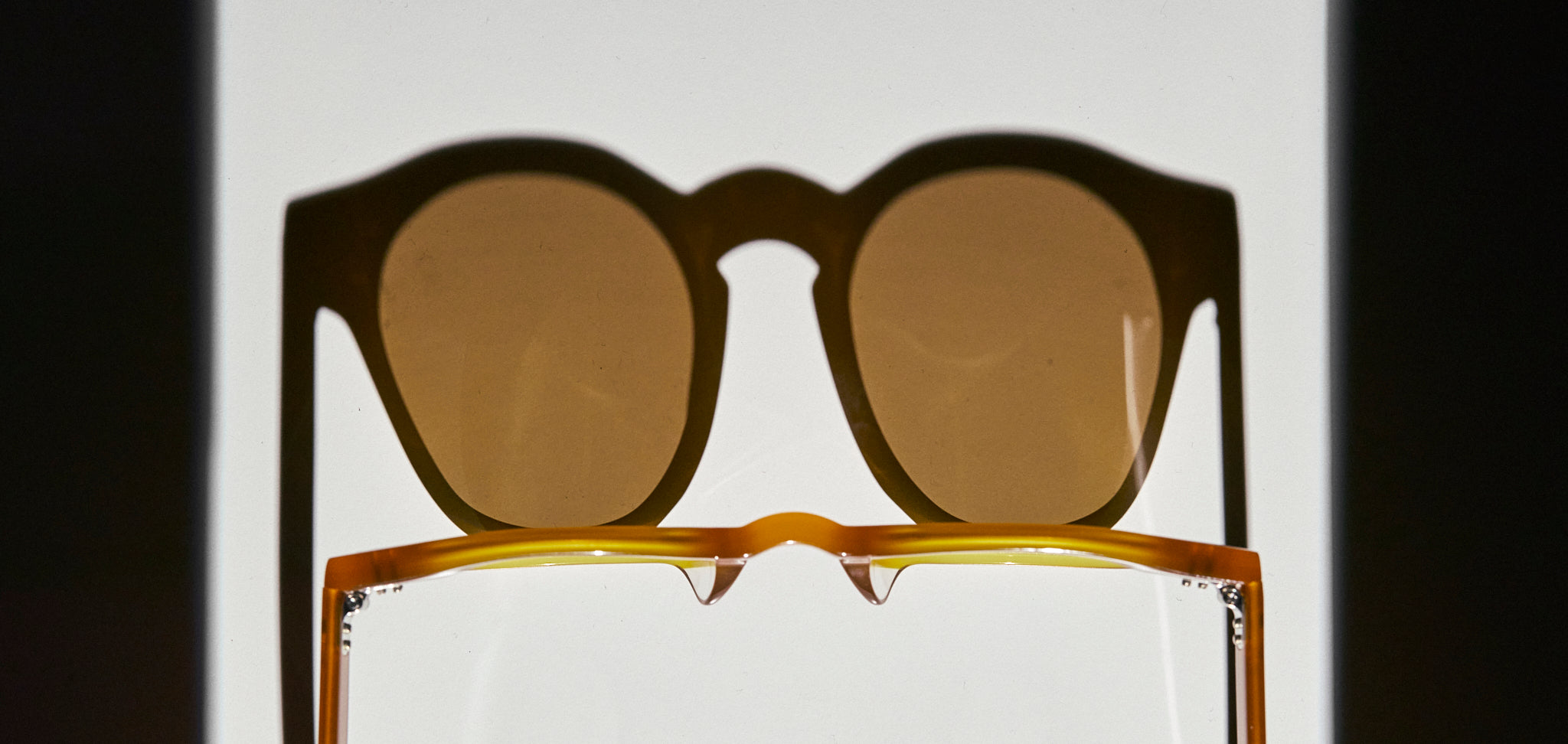 PAZ Eyewear Amber sunglasses in Honey color displayed on a white background with shadow